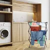 A laundry room with a washing machine and a drying rack with clothes. Produktbild-Vorschau