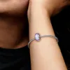 A close-up shot of a person's arm wearing a Pandora bracelet with a single purple Murano glass charm. Anteprima dell’immagine prodotto