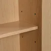 A close-up view of a wooden shelf and the side panel of a cabinet or bookcase, showing pre-drilled holes for shelf support. Podgląd zdjęcia produktu