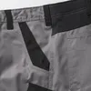 A close-up view of the waist area of gray work shorts with black accents. Produktbild-Vorschau
