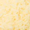 A close-up, textured view of a light yellow, fluffy material, likely yarn or stuffing. Produktbild-Vorschau