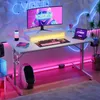 A modern gaming desk setup with LED lighting, a monitor, keyboard, and other accessories. Anteprima dell’immagine prodotto