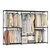 A freestanding clothing rack with multiple shelves and hanging rods, filled with various garments. Produktbild-Vorschau