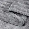 Close-up of a folded gray blanket. Produktbild-Vorschau