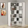 A white corner bookshelf filled with books and decorative items, placed against a light gray wall with two framed paintings. Produktbild-Vorschau