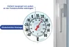 A thermometer attached to a window with text overlays explaining its features. Anteprima dell’immagine prodotto