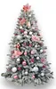 A decorated artificial Christmas tree with white flocking and pink and silver ornaments. Náhľad obrázku produktu