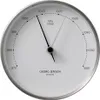 A white barometer with black markings and hands, set in a silver frame. Produktbild-Vorschau