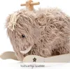 A close-up shot of a plush mammoth rocking toy. Produktbild-Vorschau