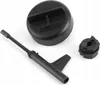 A set of black automotive tools for transmission fluid changes, including a cap, a dipstick-like tool, and a small adapter, arranged on a white background. Podgląd zdjęcia produktu