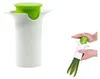 A kitchen tool for cutting vegetables, shown in use. Podgląd zdjęcia produktu