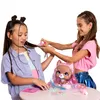 Two young girls are styling the hair of a toy pet. Podgląd zdjęcia produktu