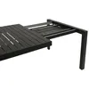A close-up view of a black extendable table with its sliding mechanism partially extended. Produktbild-Vorschau