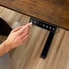 A hand is pressing buttons on a desk control panel. Náhľad obrázku produktu
