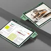 Two tablets are displayed, one in the foreground and one in the background, both in green cases. The foreground tablet shows a document with text and graphs, while the background tablet displays a sketch of a building. Anteprima dell’immagine prodotto