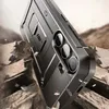 A rugged phone case is shown in a dramatic, action-oriented scene with debris flying. Produktbild-Vorschau