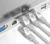 Close-up of multiple Ethernet cables plugged into a device. Produktbild-Vorschau