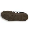 The image shows the sole of a black Adidas Handball Spezial J sneaker against a white background. Voir les images du produit