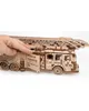 A hand is shown interacting with a wooden fire truck model. Náhľad obrázku produktu
