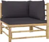 A corner piece of a bamboo outdoor lounge set with dark gray cushions, shown against a white background. Produktbild-Vorschau