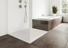 A modern bathroom with a walk-in shower and a bathtub. Anteprima dell’immagine prodotto