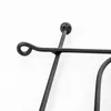 A close-up of a black metal garden fence element. Podgląd zdjęcia produktu