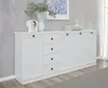 A white sideboard with black handles is displayed against a textured gray wall. Produktbild-Vorschau