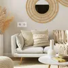 A living room scene with a sofa, pillows, a coffee table, and decorative elements. Produktbild-Vorschau