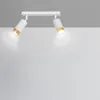 A white ceiling light fixture with two adjustable spotlights, each with a gold accent, is mounted on a white ceiling against a light gray background. Podgląd zdjęcia produktu