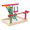 A colorful bird playground with various perches, swings, and a rope, set on a white tray. Náhled obrázku produktu