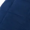 A close-up view of a quilted blue fabric. Produktbild-Vorschau