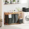 A laundry room setting with a wooden laundry sorter, washing machine, and shelves. Voir les images du produit