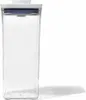 A clear, studio shot of a tall, rectangular, clear plastic food storage container with a white lid and a blue seal. Náhled obrázku produktu