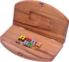 A wooden Ludo game board with colorful playing pieces and dice. Produktbild-Vorschau
