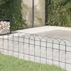 A green wire garden border fence in front of a patio and greenery. Náhled obrázku produktu