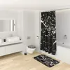 A modern bathroom with a marble-themed shower curtain, toilet seat, and bath mat. Produktbild-Vorschau