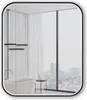 A modern bathroom with a freestanding bathtub, a large window overlooking a city skyline, and sheer curtains. Produktbild-Vorschau