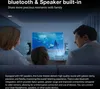 A family is watching a movie projected on a screen in a living room. Náhľad obrázku produktu