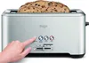 A hand is pressing a button on a silver toaster with bread inside. Produktbild-Vorschau
