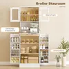 A white kitchen cabinet with multiple shelves and doors, displaying various kitchen items like jars, bowls, plates, and a coffee machine. Produktbild-Vorschau