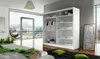 A modern bedroom with a large window overlooking a city, featuring a white wardrobe. Náhľad obrázku produktu