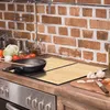 A kitchen counter with a stovetop, cooking utensils, and ingredients. Náhled obrázku produktu