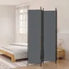 A room divider set up next to a bed in a bedroom. Voir les images du produit