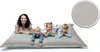 A woman and three children are lying on a large gray beanbag. Produktbild-Vorschau