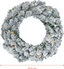 A close-up view of a snowy Christmas wreath with lights. Náhled obrázku produktu
