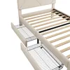 A close-up view of a bed frame with two open drawers underneath. The bed is upholstered in beige fabric and has a wooden slatted base. Produktbild-Vorschau