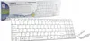 A white wireless keyboard and mouse combo is displayed on a white background, with its packaging shown above. Náhľad obrázku produktu