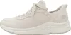 A side view of a beige Skechers sneaker. Produktbild-Vorschau
