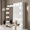 A vanity table with a mirror and makeup accessories. Náhled obrázku produktu