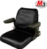 A black seat cover for a construction machine, shown from the front. Anteprima dell’immagine prodotto